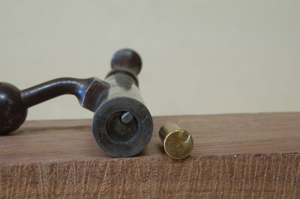 The firing pin tip of the Model X is large and has a heavy impact on the case at right.